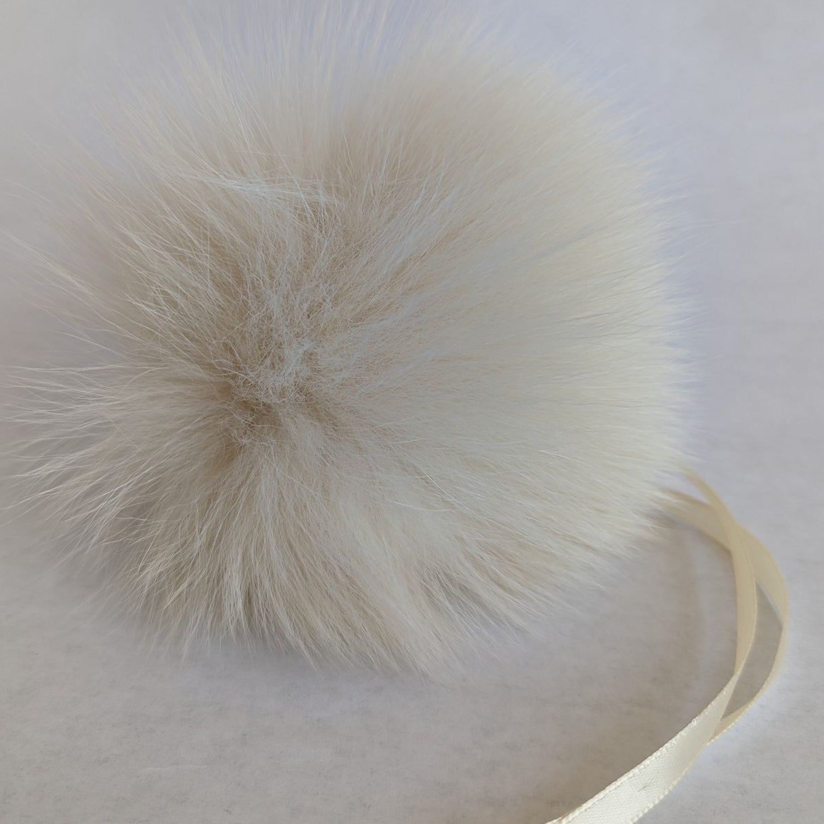 fox fur pom cream
